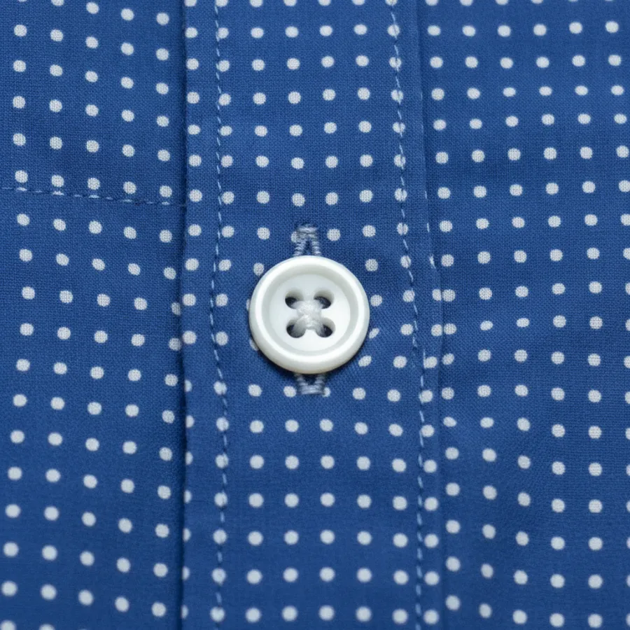 Closure detail shot of a blue check shirt