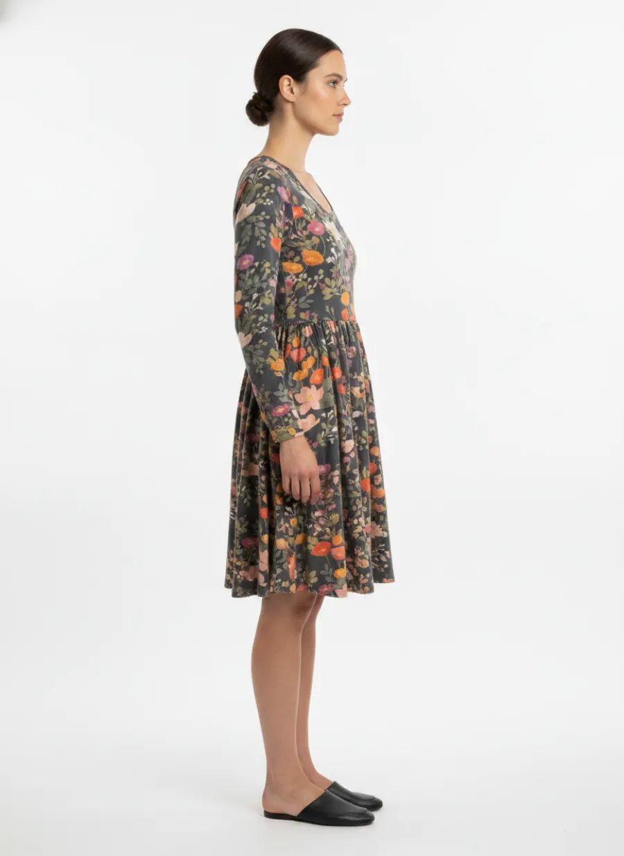 On-model side shot of a navy floral dress